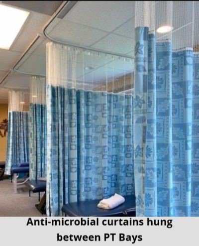 Anti-microbial curtains hung between PT bays