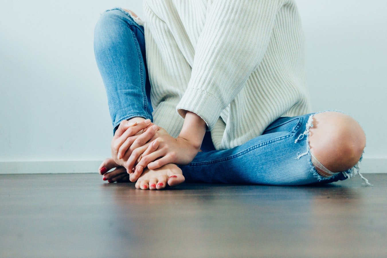 Woman with sore feet from Plantar Fasciitis