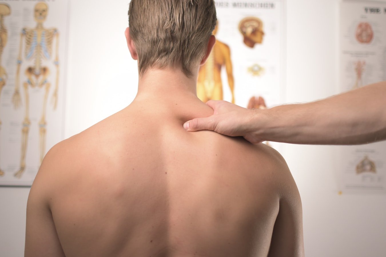 A man sees a doctor for back or neck pain