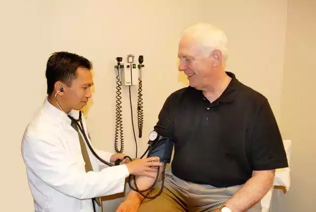 Doctor Checking Blood Pressure