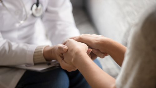 doctor holding patient