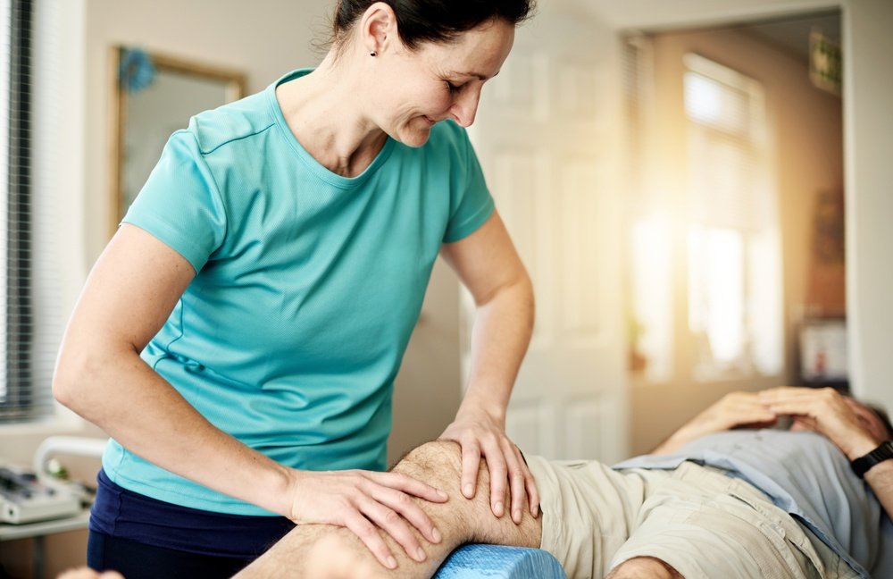 A foot and ankle specialist examining a patient