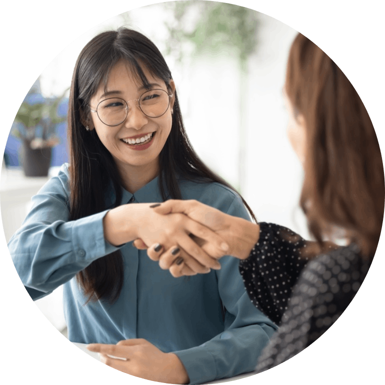 Two women smiling in an interview