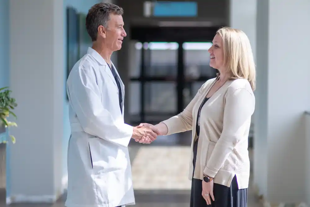 Doctor Shaking Hands with Woman