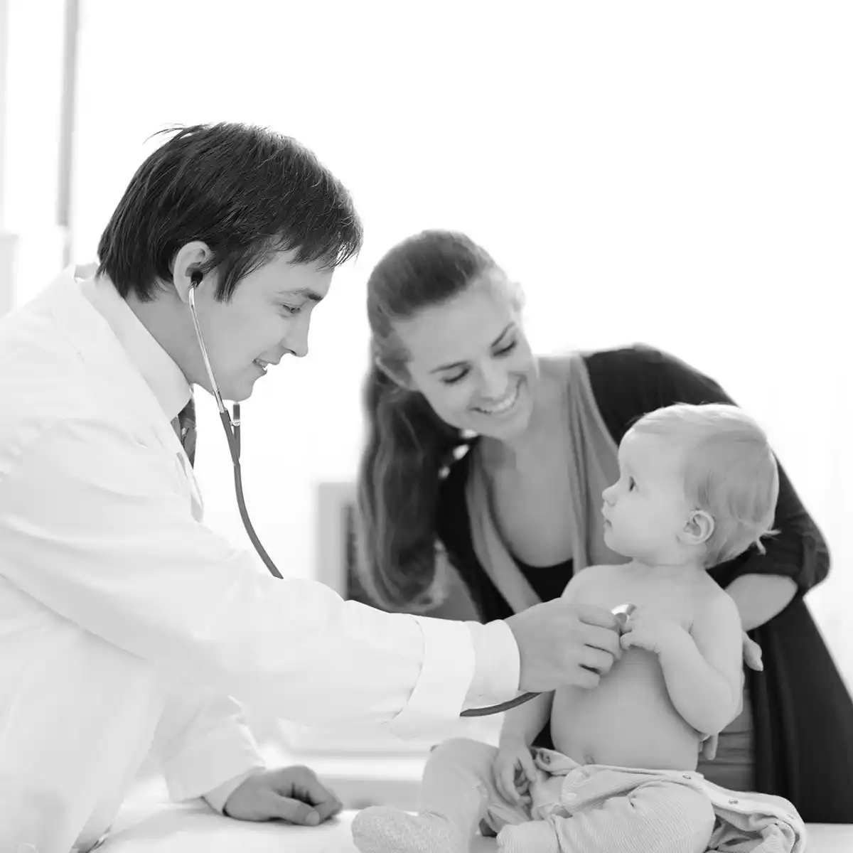 Doctor with child and parent