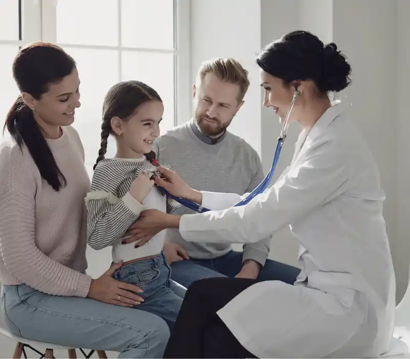 Doctor with child and parent