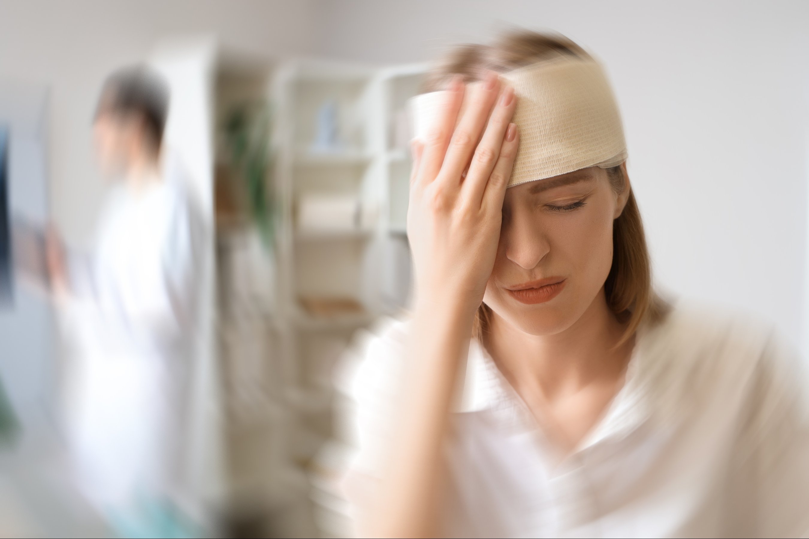 woman with brain concussion visiting doctor in clinic