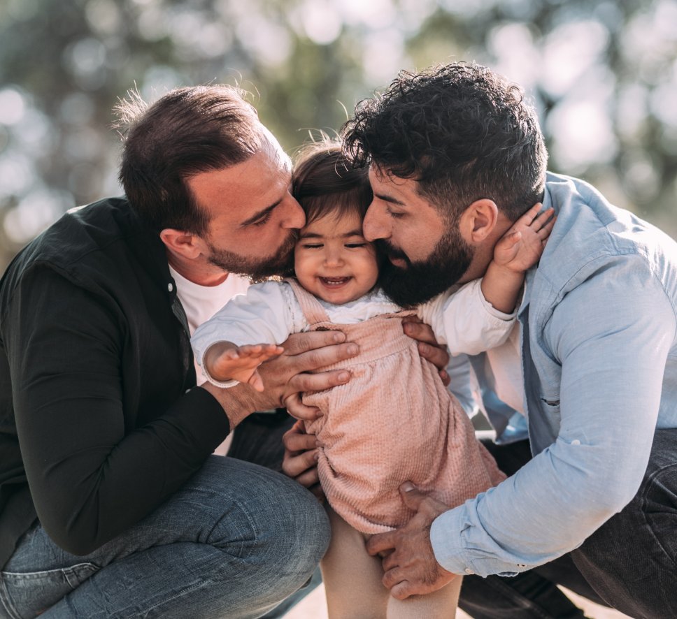 A happy gay couple with child after taking Surrogacy services for Gay Couplesin colombia