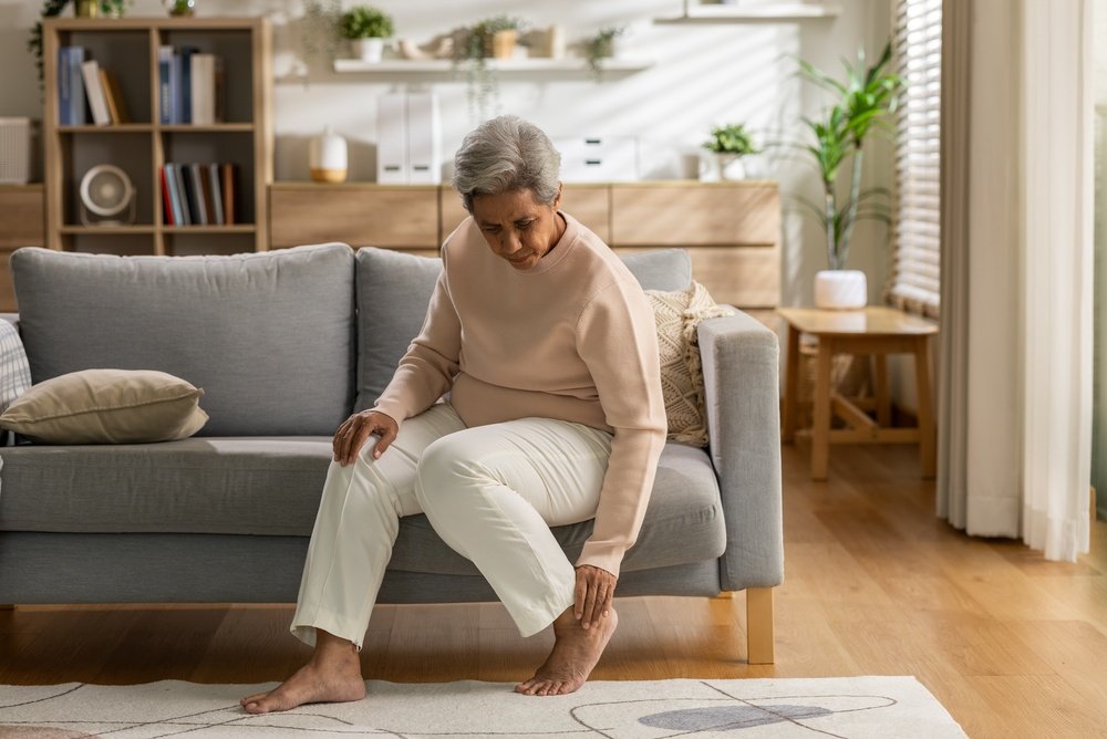 A podiatrist examining a patient