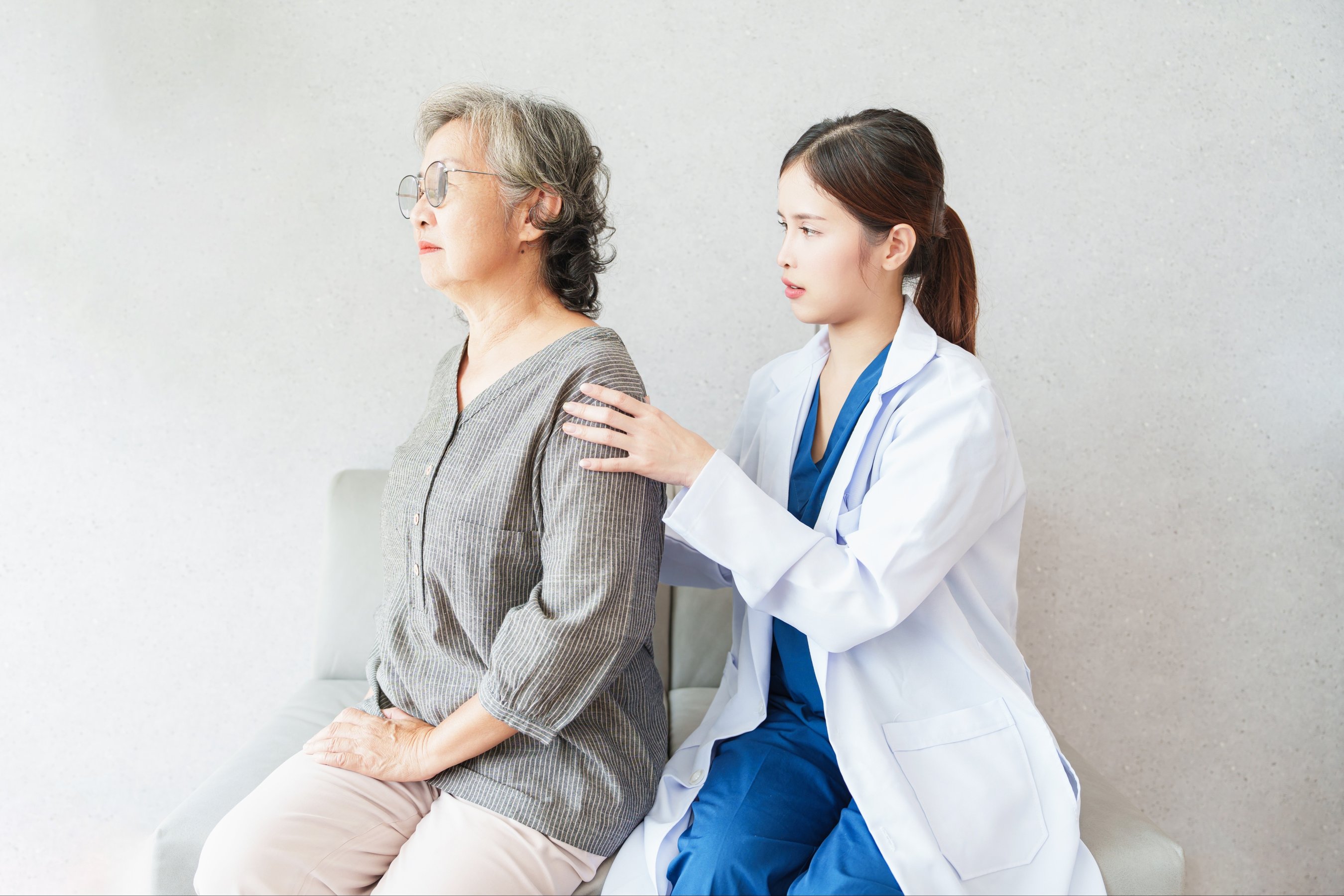 senior woman patient during lower back exam