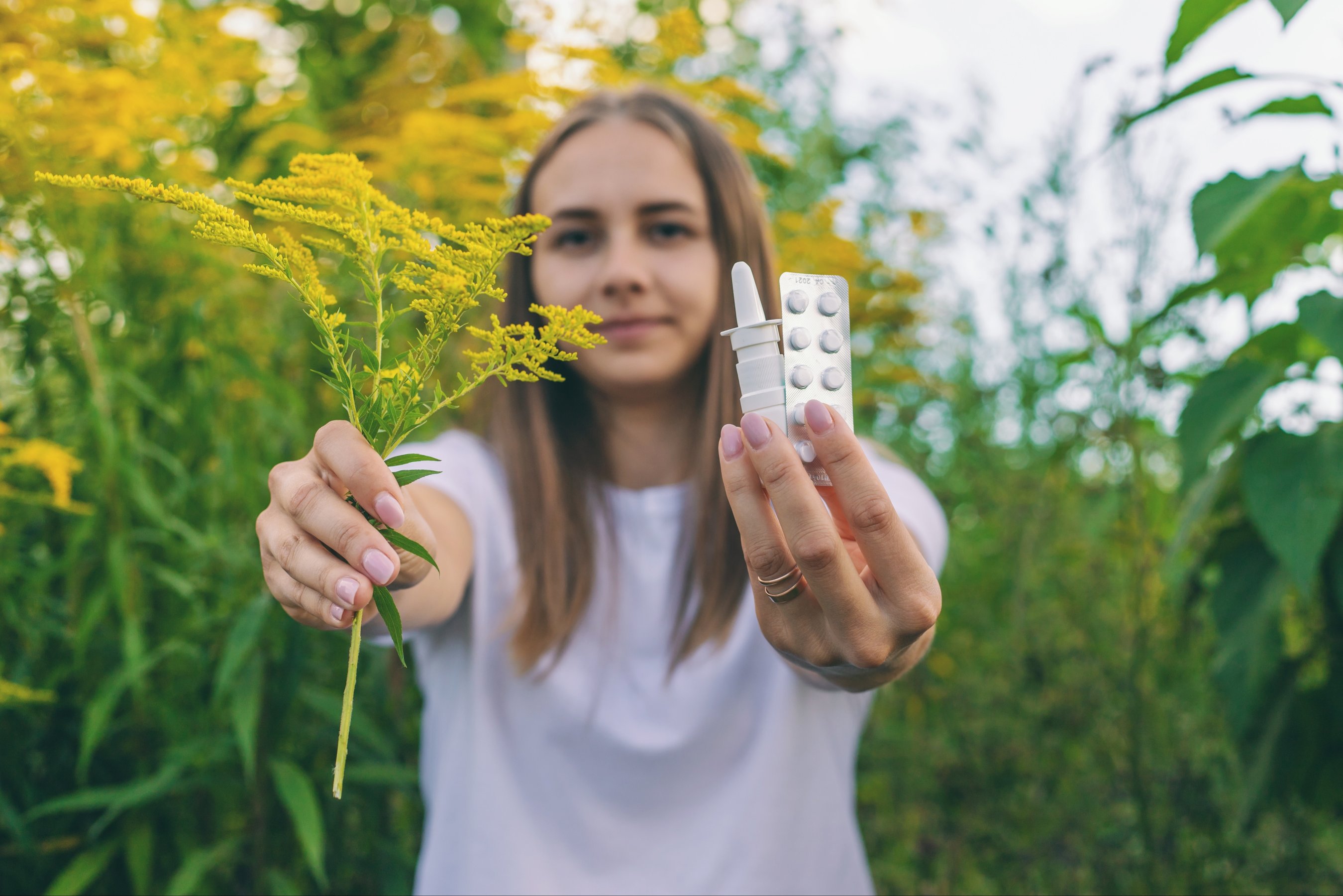 The girl is allergic to ragweed Spray and allergy medicine