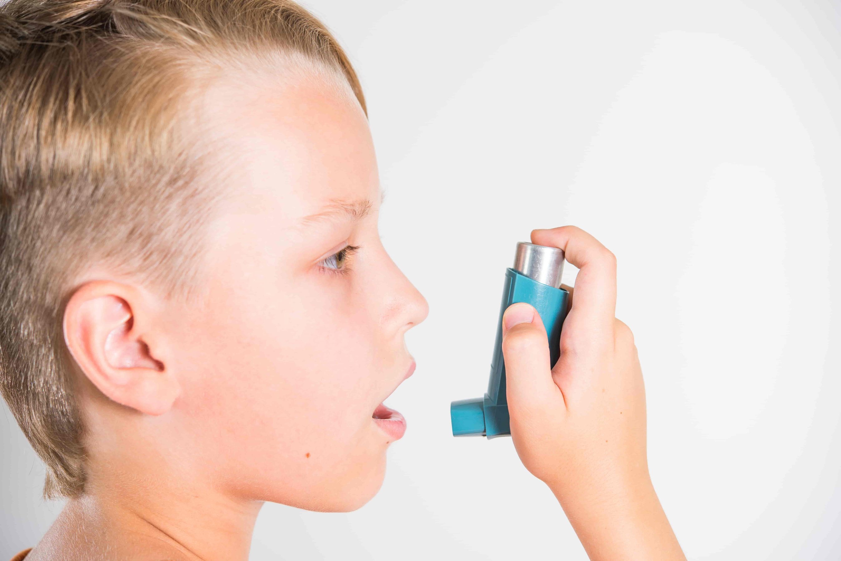 child with an inhaler