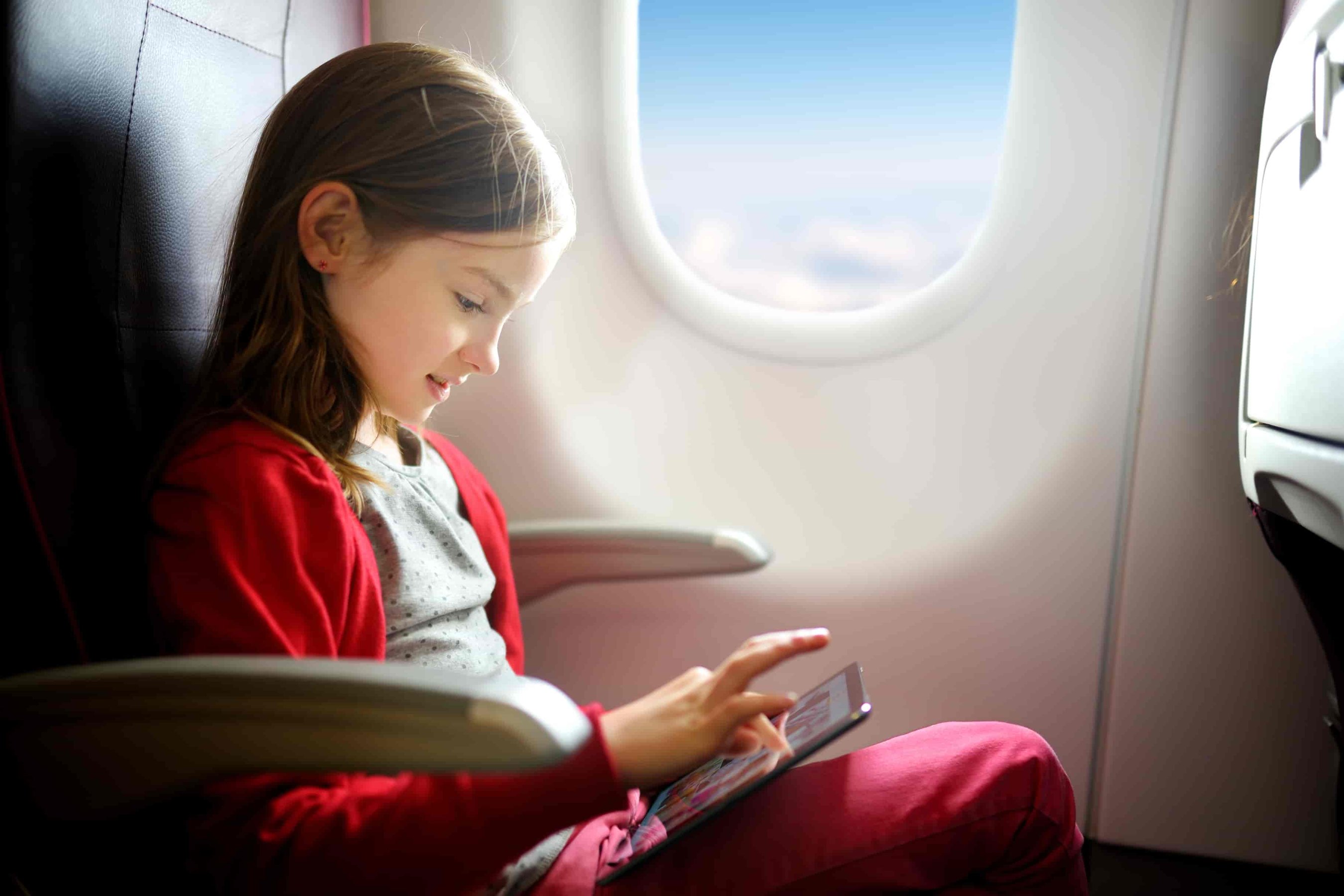 Little girl travelling by an aeroplane