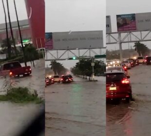 Vehículos quedaron varados en la Avenida Riviera Nayarit por inundación.