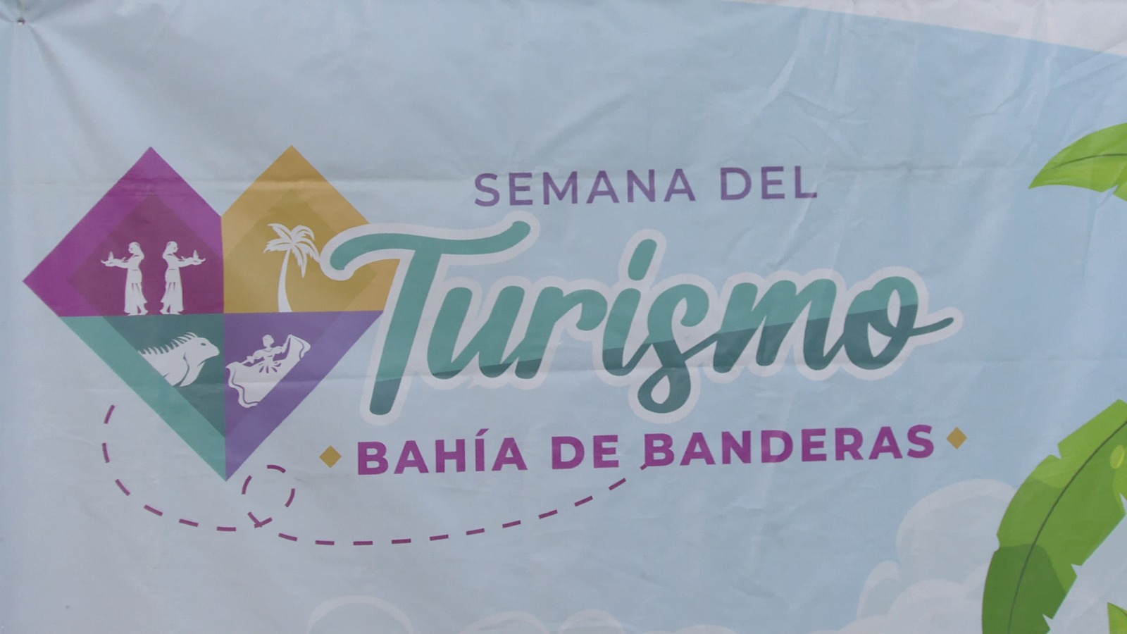 Cartel sobre Día Mundial del Turismo en Bahía de Banderas