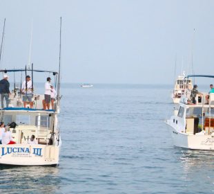 Pescadores en embarcaciones