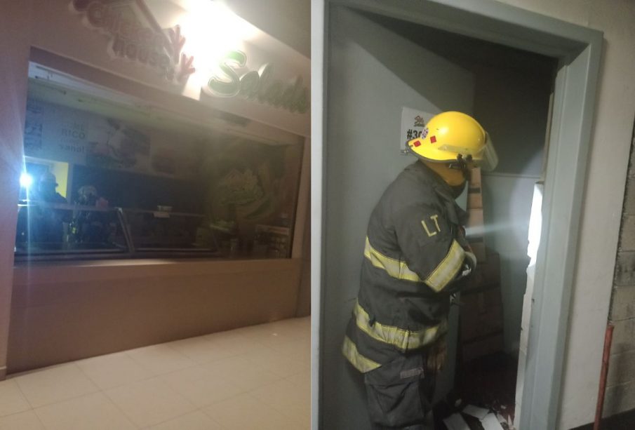 Bomberos controlando incendio en plaza comercial