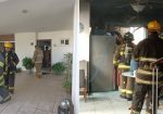Bomberos sofocando incendio en casa