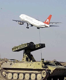 After almost one week in Afghanistan, an empty Indian Airlines plane that was hijacked by militants takes off for India in Kandahar on Saturday.