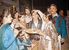 The mother of Rakesh applies a tilak on her sons forehead as she welcomes him and Pooja, his wife, after they returned to the city from New Delhi late this evening after a week-long aeroplane hijack ordeal.