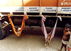 Children's cradle tied to a striking truck in Mumbai as transporters go on strike on Monday. 