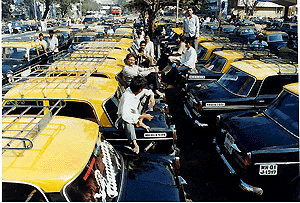 Drivers sit on their taxis at Mumbai Central on Tuesday as the transporters strike enters the second day.  PTI