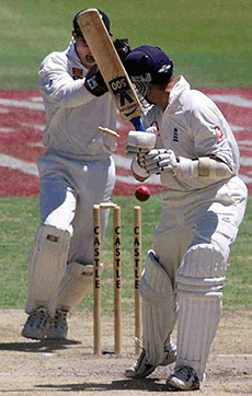 England's Alec Stewart, turns to see his bails leave the stumps as he is bowled for 5 runs, off the bowling of Paul Adams during the fourth day of the 4th Test at the Newlands cricket ground Cape Town, Wednesday. 