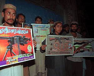 Supporters of Harakat-ul-Mujahedeen, listen the speech by their leader Maulana Masood Azhar on in Karachi on Wednesday. Azhar is one of three prisoners freed by India to end the harrowing 8-day hijacking of an Indian Airlines plane and he says the five hijackers "are preparing for their next assault."