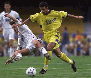 Moussa Saib of Saudi Arabia's Al Nassr team fights for the ball against Fernando Carlos Redondo of Spain's Real Madrid team during the opening game of the First FIFA Club World Championship at the Morumbi Stadium in Sao Paulo, Brazil on Wednesday