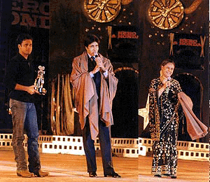 Amitabh and Jaya Bachchan receive their award at the Stardust Hero Honda millennium awards from Manoj Vajpai (left) in Mumbai on Friday night
