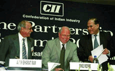 Director General, World Trade Organisation (WTO) Mike Moore (centre) with Rahul Bajaj, President CII (centre) at the CII's partnership summit 2000 in New Delhi on Monday