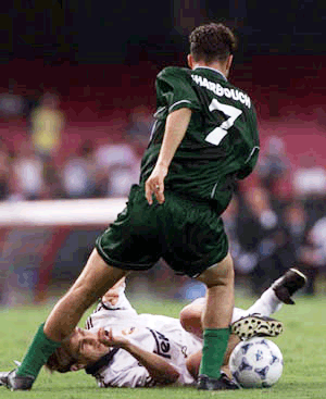 Savio Bortoloni of Spain's Real Madrid, on ground, team gets fouled by Mohamed Kharbouch of Morocco's Raja Casablanca team during a game of the First FIFA Club World Championship at the Morumbi Stadium in Sao Paulo, Brazil Monday Jan. 10, 2000