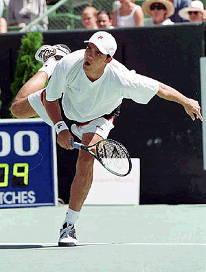 Australian tennis star Mark Philippoussis sends down a rocket serve during his 7-6,7-6, victory over American Pete Sampras at the Colonial Classic in Melbourne Australia on Friday 