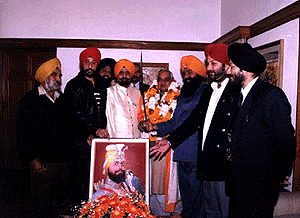 Prime Minister Atal Behari Vajpayee is presented a siropa by the president of the Delhi unit of the SAD on the occasion of Guru Gobind Singhs birth anniversary, in the Capital on Friday