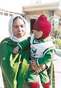 Jabir Kaur with her one-year-old son Devinder Singh