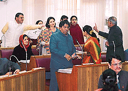 BJP and Congress councillors have an argument over an issue at a meeting of the corporation in Chandigarh on Monday.  Tribune photo by Parvesh Chauhan