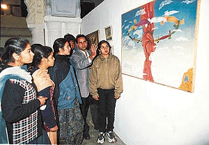 Gurinder Jassal explaining his work at an art exhibition at Banaras Art Gallery in Patiala on Tuesday