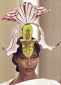  PARIS : British top model Naomi Campbell presents an orchid shaped hat during Irish fashion hat designer Philippe Treacy's Haute Couture spring/summer collection presented in Paris on Tuesday. AP/PTI