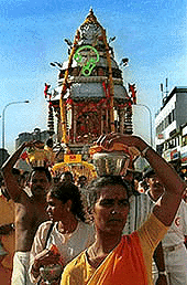 Malaysian Hindu devotees carry paal kudam (milk pots) on their heads to fulfil vows during a 10-km procession to signal the start of Thaipusam, an annual festival symbolising the struggle between good and evil, on Thursday in Kuala Lumpur. The eight-hour pilgrimage through the Malaysian capital drew about 50,000 Hindu devotees