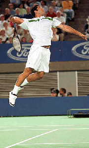 American Pete Sampras from Orlando, leaps high off the center court to smash against Wayne Black from Zimbabwe at the Australian Open Tennis Championships in Melbourne on Friday
