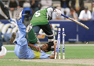 Debashish Mohanty of India (bottom) collides with Yousof Youhanna of Pakistan (top) as he attempts to run him out during their tri-series one-day international at Bellerive oval in Hobart on Friday