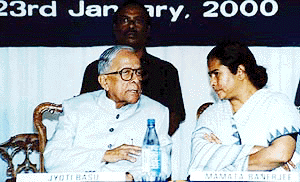 West Bengal Chief Minister Jyoti Basu talks to Union Railway Minister Mamata Banerjee at the foundation laying ceremony of Gujarat Ambuja Cement plant at Howrah on Sunday