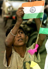 A street child decorates his temporary living camp with a