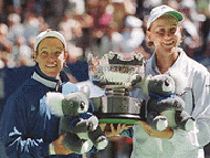 American Lisa Raymond (left) poses with her doubles partner Australia's Rennae Stubbs after their victory in the women's doubles final over Martina Hingis of Switzerland and Mary Pierce of France at the Australian Open Tennis Championships in Melbourne on Friday