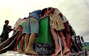 East Timorese children rummage for food