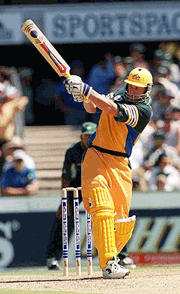 Australian opening batsman Adam Gilchrist hits a boundary, scoring 51 runs during the second one day-night final against Pakistan in Sydney on Friday