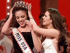 Lynnette Cole (left) is crowned Miss 2000 by Kim Pressler, Miss USA, 1999, during the pageant finals in Branson, on Friday