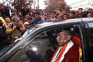 The 17th Karmapa lama, Urgyen Trinley Dorje, leaves the Dalai Lama's residence on Tibetan New Year's day in Dharmshala, Sunday. The Karmapa lama had a one hour long audience with the Dalai Lama to celebrate Tibetan New Years