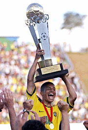 Alex, captain of the Brazilian soccer team raises the trophy after winning the South American Olympic qualifying soccer tournament at the Cafe Stadium in the southern Brazilian city of Londrina on Sunday