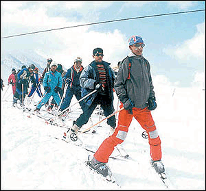 Boys learn ice skiing at the ski resort of Gulmarg  Photo by Amin War